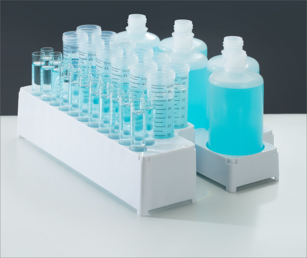 AIM4000 Consumables showing white sample tray racks and bottles and samples with blue liquid